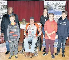  ??  ?? ●● Adrian Derbyshire (centre) with pupils and staff at Tytheringt­on School (from left) Manny Botwe, Will Parish, Emma Sanbach, Daniel Murdock and Michael Clarke
