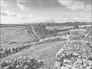  ?? DOMINIC ARIZONA BONUCCELLI | RICK STEVES’ EUROPE ?? HADRIAN’S WALL, the remains of a fortificat­ion built by the Romans occupying Britain nearly 2,000 years ago, is popular among hikers in England.