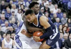  ?? NATI HARNIK — THE ASSOCIATED PRESS ?? Villanova’s Phil Booth, front, and Creighton’s Kaleb Joseph, rear, struggle for the ball during the second half of an NCAA college basketball game in Omaha, Neb., Sunday.