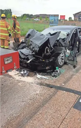  ?? SOUTH JORDAN POLICE DEPARTMENT/AP ?? This Model S slammed into a stopped fire truck Friday in South Jordan, Utah. The driver, 28, says she was going about 60 mph.