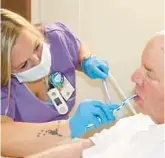  ?? COURTESY ?? James Massie, an Army veteran and a patient at the Salem Veterans Affairs Medical Center in Salem, Virginia, gets his teeth brushed by nursing assistant Teresa Quarles in June.