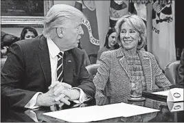  ?? [ASSOCIATED PRESS FILE PHOTO] ?? President Donald Trump and Education Secretary Betsy DeVos are strong proponents of school choice.