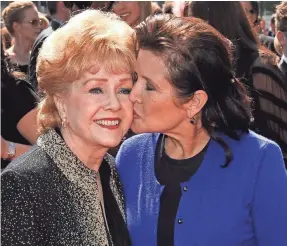  ?? CHRIS PIZZELLO/AP ?? Debbie Reynolds and Carrie Fisher died a day apart in 2016. Todd Fisher says “My Girls” is a “long love letter and thank-you note” to them.