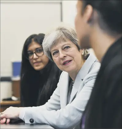  ?? PICTURES:PA WIRE. ?? EDUCATION IN SPOTLIGHT: Prime Minister Theresa May talks with pupils and staff during a school visit.
