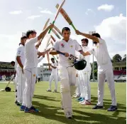  ?? — AFP ?? Members of the Pakistan team give a guard of honour to Younis Khan on the fourth day of their final Test against the West Indies at the Windsor Park Stadium in Roseau, Dominica, on Saturday.