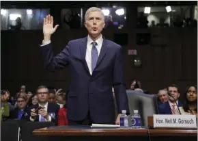  ??  ?? Supreme Court Justice nominee Neil Gorsuch is sworn-in on Capitol Hill in Washington on Monday during his confirmati­on hearing before the Senate Judiciary Committee. AP PHOTO/ PABLO MARTINEZ MONSIVAIS