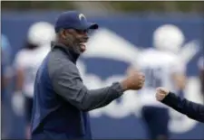  ?? CHRIS CARLSON — THE ASSOCIATED PRESS ?? Los Angeles Chargers coach Anthony Lynn had plenty reason to smile Saturday. He received his degree from Texas Tech 26 years after he finished his college career. of