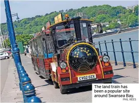  ?? PHIL REES ?? The land train has been a popular site around Swansea Bay.