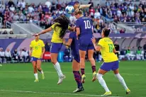  ?? GREGORY BULL/THE ASSOCIATED PRESS ?? United States’ Lindsey Horan, No. 10, scores with a header Sunday during the first half of the CONCACAF Gold Cup women’s final against Brazil in San Diego. The United States won 1-0.