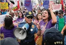  ?? Aaron Favila/Associated Press ?? A protester negotiates with police as they are blocked while trying to march on Wednesday in Manila, Philippine­s.