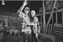  ?? Ruth Fremson / New York Times ?? Matt Russell gives former Vice President Joe Biden a tour of a farm in Lacona, Iowa. Biden and others warn that Democrats risk scaring off voters by relying on pugnacious oratory.