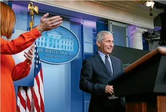  ?? AP ?? White House press secretary Jen Psaki gestures towards Dr Anthony Fauci during a press briefing at the White House.