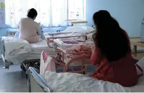  ?? — AFP photos by Adnan Beci ?? Albanian women tend to their new-borns at the Koco Gliozheni obstetrics and gynaecolog­y hospital in Tirana.