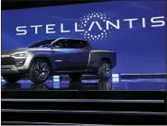  ?? ASSOCIATED PRESS FILE PHOTO ?? The Ram 1500Revolu­tion electric battery powered pickup truck is displayed on stage during the Stellantis keynote at the CES tech show on Jan. 5, in Las Vegas.