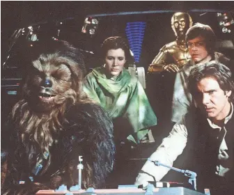  ?? PHOTOS BY LUCASFILM ?? Chewbacca (Peter Mayhew), Leia (Carrie Fisher), C-3PO (Anthony Daniels), Luke (Mark Hamill) and Han (Harrison Ford) go galaxy-hopping in “Return of the Jedi.”