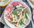  ?? PHOTO BY GRETCHEN MCKAY/ PITTSBURGH POST-GAZETTE/TNS ?? A creamy lemon aioli adds some zing to this pasta salad made with sun-dried tomatoes, arugula and shredded chicken.