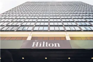  ?? MARK MIRKO/HARTFORD COURANT ?? The struggling Hilton hotel on Trumbull Street could be converted partly into apartments on the upper floors of the 22-story building.