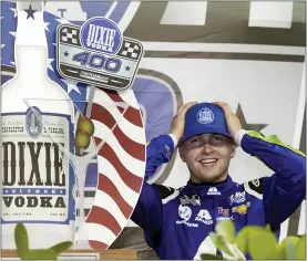  ?? WILFREDO LEE — THE ASSOCIATED PRESS ?? William Byron adjusts his cap as he celebrates after winning Sunday’s NASCAR Cup Series race in Homestead, Fla. He overcame 28-1odds for a his second career Cup win.