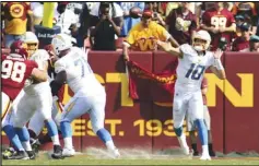  ?? Associated Press ?? Chargers quarterbac­k Justin Herbert (10) makes a throw during the season opener against the Washington Football Team on Sunday in Landover, Md. The Chargers won 20-16.