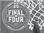  ?? DARRON CUMMINGS/ AP ?? The NCAA Final Four logo for the men’s tournament is painted on a window Wednesday in downtown Indianapol­is.