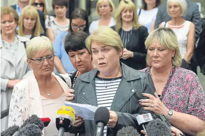  ?? Picture: PA. ?? Victim Patricia Welch, centre, reads a statement alongside Judith Conduit, left, and Frances Perks, right, outside Nottingham Crown Court yesterday.