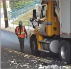  ?? PETE BANNAN MEDIANEWS GROUP ?? An Amtrak official inspects damage after a truck crashed into the Amtrak bridge in Prospect Park.