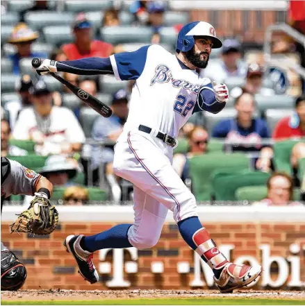  ?? SCOTT CUNNINGHAM / GETTY IMAGES ?? Nick Markakis drives home the Braves’ third run Sunday with a third-inning double against the Orioles at SunTrust Park. Markakis, who played nine seasons in Baltimore, picked up his National League-leading 98th and 99th hits in his 76th game.