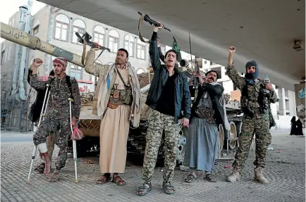  ?? PHOTO: AP ?? Houthi fighters chant slogans as they guard a street in Yemen’s capital, Sanaa, leading to the residence of former Yemeni president Ali Abdullah Saleh, a former Houthi ally who was killed after he switched sides in the country’s civil war.