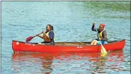  ?? SUBMITTED PHOTO ?? Zyonna Boykin, right, of Coatesvill­e and Jasmine Rodriguez learn to paddle a canoe as they prepare for the Brandywine Trek at Chambers Lake at Hibernia Park in West Caln.