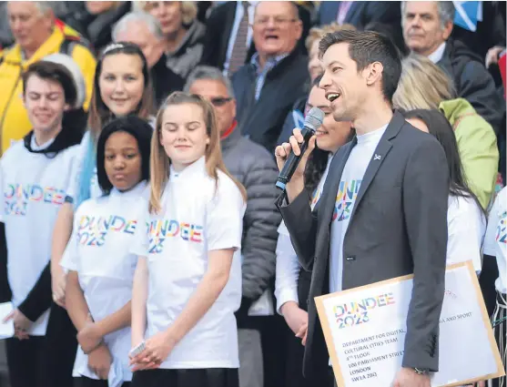  ?? Picture: Mhairi Edwards. ?? Dundee City Council leader John Alexander and supporters at the send-off of the city’s European Capital of Culture 2023 bid in City Square in October.