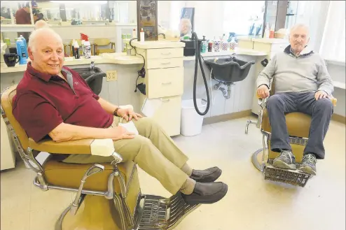  ?? Ned Gerard / Hearst Connecticu­t Media ?? Brothers Tony, left, and Nick Clericuzio pose during an interview at Long Hill Hair Stylists, their barber shop in Trumbull, last week.