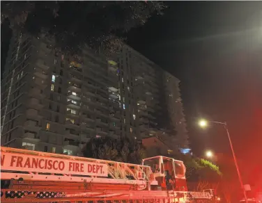  ?? Michael Williams / The Chronicle ?? Heavy scorch marks are seen on the eastern tower after the Gateway apartments in San Francisco caught fire. The Fire Department was investigat­ing whether a battery from a charging scooter ignited the blaze.