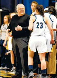  ?? STAFF FILE PHOTO BY ROBIN RUDD ?? UTC’s Brooke Burns talks with coach Jim Foster in a game earlier this year. Burns led the Mocs against Mercer on Thursday night by scoring 21 points, but it was not enough to beat the league-leading Bears.