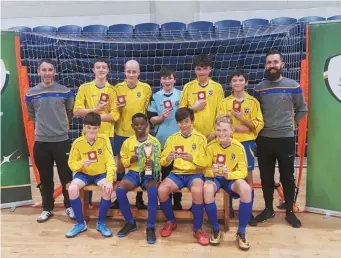  ??  ?? Congratula­tions to the 1st Year Futsal Squad from St. Mary’s Diocesan School on winning the Leinster title on Wednesday 13th November. St. Mary’s also won the Leinster title last year.
The squad will go on to represent Leinster at the All-Ireland Competitio­n in WIT Arena, Waterford on the 5th December, where hopefully they can become all Ireland Champions.
Squad list from Photo: Mr. Brett, Paul Galvin, Eamonn Armstrong, Oran Collins, Leon Luzha, Ethan Burke, Mr. Hobbs. Front Row: Sam Heeney, Andrew Olajide, Alex Divine, Kyle Morris.