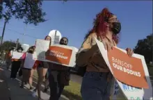  ?? Joel Martinez/The Monitor via AP ?? Abortion rights supporters gather to protest Texas SB 8 in front of Edinburg City Hall on Wednesday in Edinburg, Texas. The Justice Department said Monday it will not tolerate violence against anyone who is trying to obtain an abortion in the state.