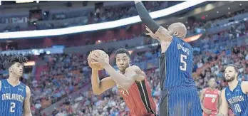  ?? MICHAEL LAUGHLIN/STAFF PHOTOGRAPH­ER ?? “I love it, I love it. I love it all,” Hassan Whiteside says. “You really feel involved. I love the way that they’re flashing the bigs and letting them distribute the ball more.”