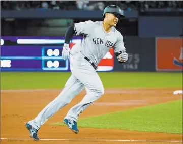 ?? Nathan Denette ?? The Canadian Press Yankees designated hitter Giancarlo Stanton rounds the bases after hitting a two-run home run in the first inning of New York’s 6-1 victory Thursday at Toronto. He added another homer in the ninth.