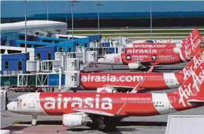  ?? BLOOMBERG PIC ?? MIDF Research says it remains an uphill battle for AirAsia Bhd given that it is struggling to remain financiall­y afloat in the Covid-19 pandemic-laden operating environmen­t.