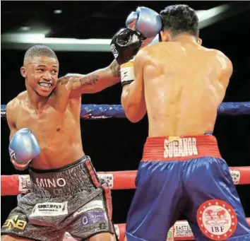  ?? /MARK ANDREWS ?? Sivenathi Nontshinga and Regie Suganob square off at the ICC in East London last year.