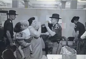  ??  ?? Welfare recipients clash with Milwaukee County sheriff's deputies in the welfare department office on Sept. 4, 1968. Nine women, some carrying children, and a man in a wheelchair were arrested after staging a protest for higher payments for clothing and basic needs. This photo was published in the Sept. 5, 1968, Milwaukee Sentinel.