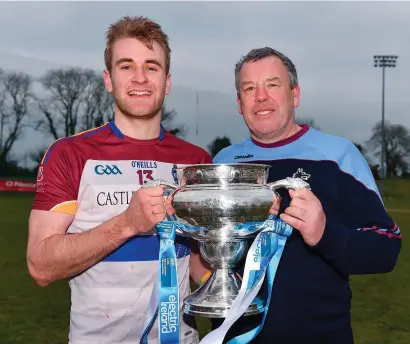  ?? DIARMUID GREENE/SPORTSFILE ?? UL captain John McGrath and manager Gary Kirby with the Electric Ireland Fitzgibbon Cup after their victory over DCU in Mallow