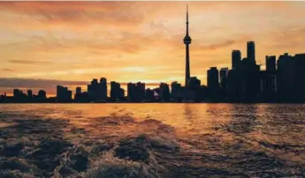  ?? JAMAL (JAYSCALE) BURGER/COURTESY LG ?? The Toronto skyline taken from a boat in the harbour.