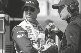  ?? JASON MINTO/AP ?? DENNY HAMLIN (11) April 30 in Dover, Del. before a series auto race at Dover Motor Speedway on