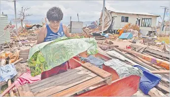  ?? Picture: FT FILE ?? Taraivini Likudrotin­i of Galoa Island dries out clothes on the wooden structures of her
home which was destroyed by TC Yasa.