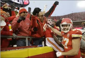  ?? CHARLIE RIEDEL — THE ASSOCIATED PRESS ?? Chiefs tight end Travis Kelce (87), a Cleveland Heights High School grad, celebrates with fans after tight end Blake Bell scored a touchdown against the Texans on Jan. 12.