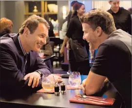  ?? DirecTV ?? STANLEY (Julian McMahon, left) helps Jace (David Boreanaz), a profane and wildly homophobic comic, with damage control in an episode of “Full Circle.”