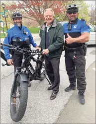  ?? Greenwich Police Department / Contribute­d photo ?? Talk show host Jerry Springer, center, checks out the new equipment for the Greenwich Police Department’s bike unit Friday on Greenwich Avenue. Greenwich Police Officers John D’Inverno and Robert Smurlo are part of the new community policing initiative.