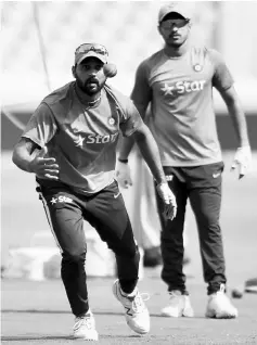  ?? — AFP photo ?? India’s Murali Vijay catches a ball during a team practice session on the eve of a Test match between India and Bangladesh at The Rajiv Gandhi Internatio­nal Cricket Stadium in Hyderabad.