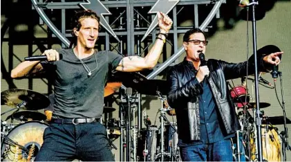  ?? AMY HARRIS AP ?? Saget performs with David Shaw of The Revivalist­s during the KAABOO music festival at the Del Mar Fairground­s in 2019.