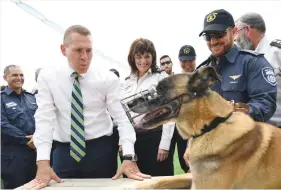  ?? (Israel Prisons Service) ?? PUBLIC SECURITY MINISTER Gilad Erdan and Prisons Service Commission­er Ofra Klinger attend the inaugurati­on of the retirement home for security dogs in Damon Prison last Tuesday.